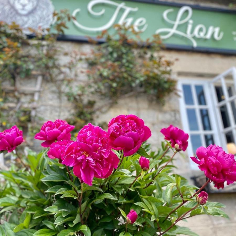 The Lion At West Pennard Hotel Exterior photo Peonies in bloom