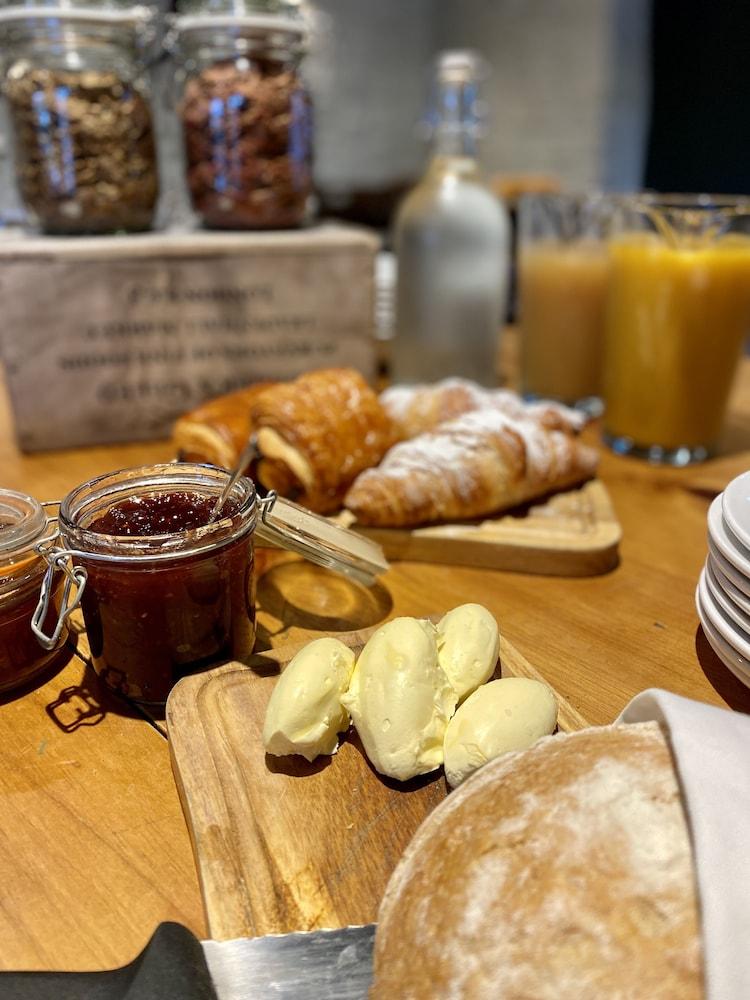 The Lion At West Pennard Hotel Exterior photo Croissants and butter at a breakfast buffet
